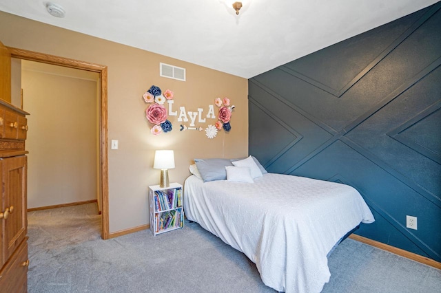 bedroom with visible vents, baseboards, and carpet floors