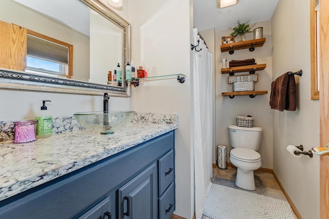 full bathroom featuring tile patterned floors, baseboards, toilet, and vanity