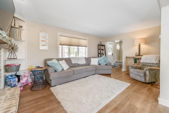 living area with light wood-style floors