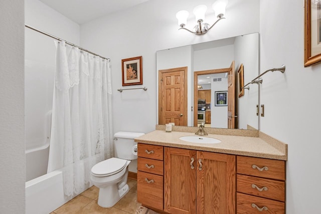 bathroom featuring vanity, an inviting chandelier, shower / bath combination with curtain, tile patterned floors, and toilet