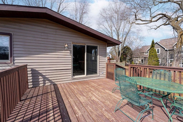 deck featuring outdoor dining area