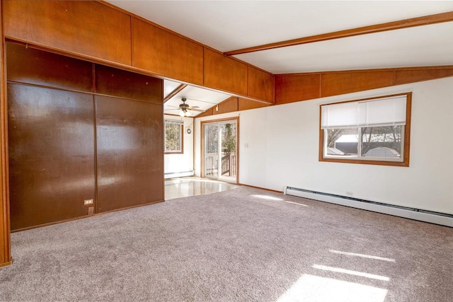 interior space with a baseboard radiator, plenty of natural light, ceiling fan, and vaulted ceiling with beams