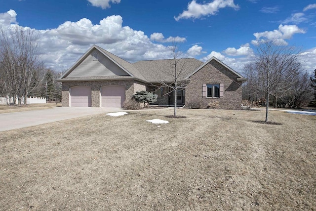 ranch-style home featuring brick siding, a garage, and driveway