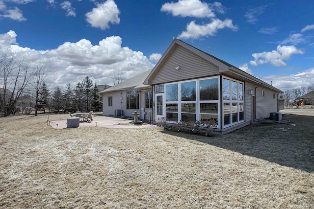 back of property featuring central air condition unit and a patio