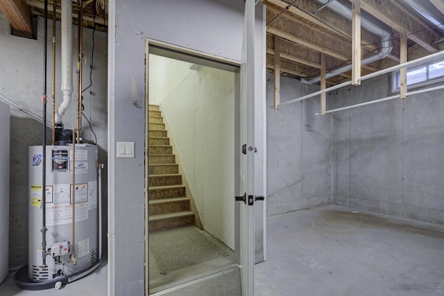 unfinished below grade area with gas water heater and stairway