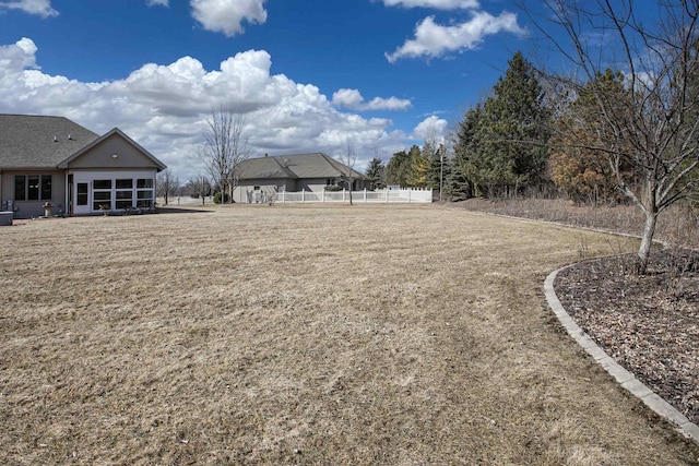 view of yard featuring fence