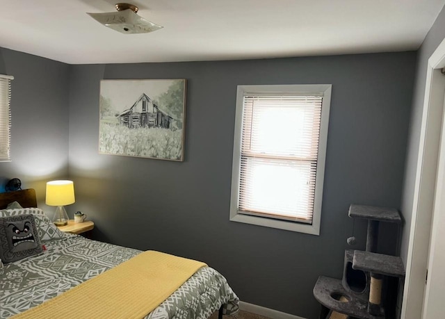 bedroom featuring baseboards