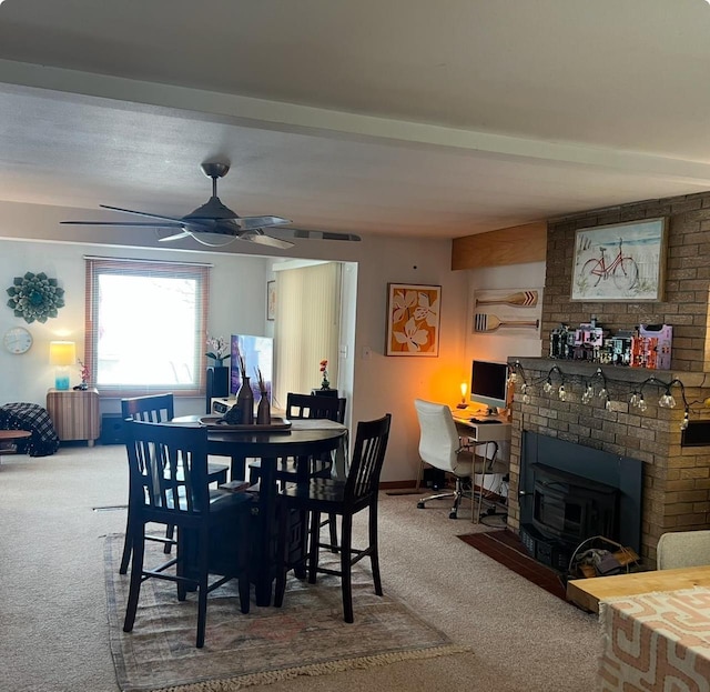 dining room with carpet, baseboards, and ceiling fan