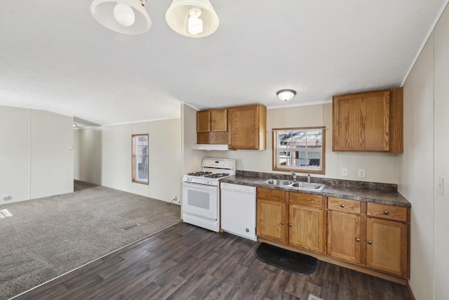 kitchen featuring a sink, dark countertops, white appliances, brown cabinetry, and dark wood-style flooring