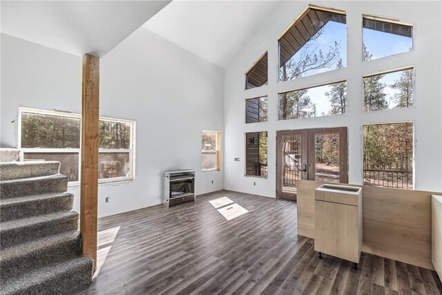 S10460 Black Creek Rd, Fairchild, WI 54741 - living room with dark wood-style floors, high vaulted ceiling, stairway, and french doors