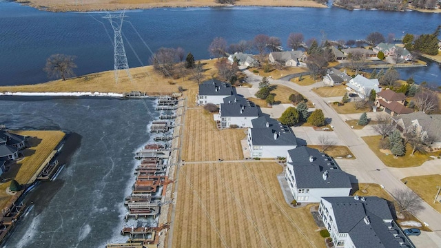 bird's eye view featuring a residential view and a water view