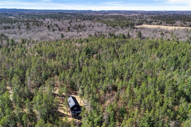 birds eye view of property featuring a forest view