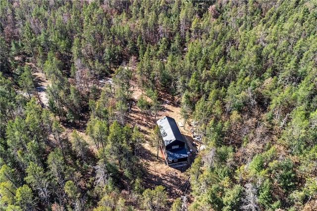 aerial view featuring a wooded view