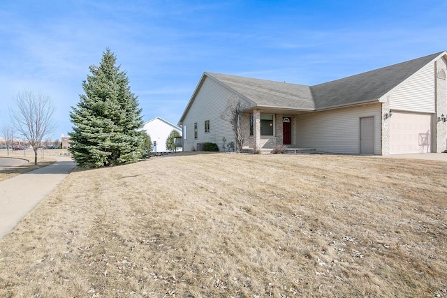 ranch-style house with driveway and a garage