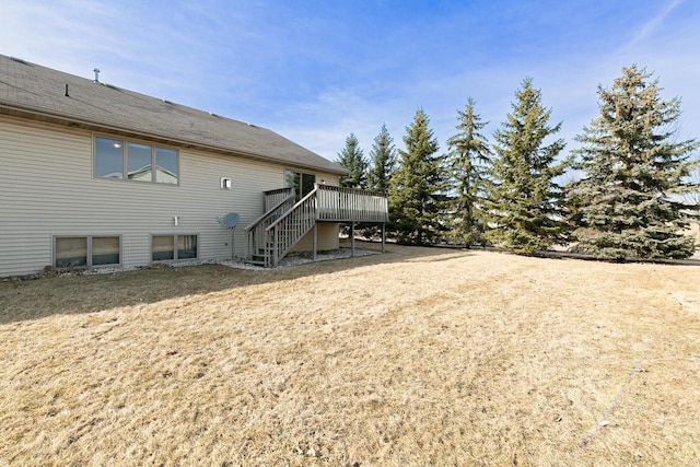 view of yard with stairway and a wooden deck