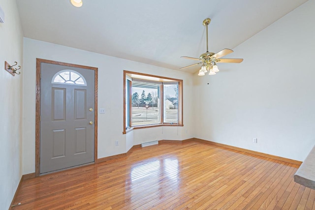 entrance foyer featuring visible vents, a ceiling fan, light wood-type flooring, and baseboards