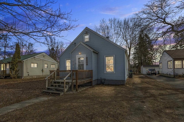 view of front of home featuring an outbuilding