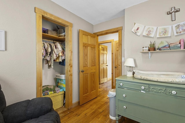 interior space with a closet and wood finished floors