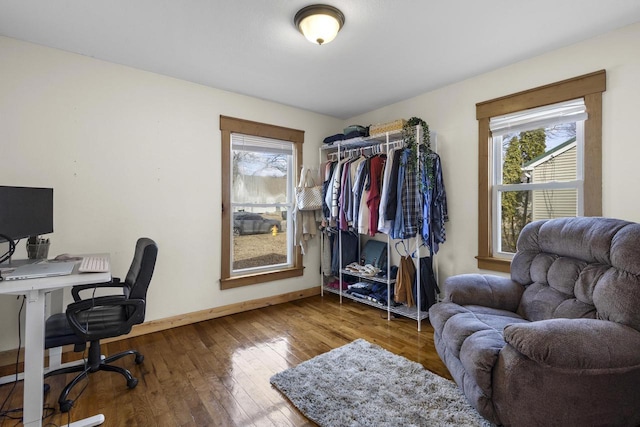 office featuring baseboards and hardwood / wood-style flooring