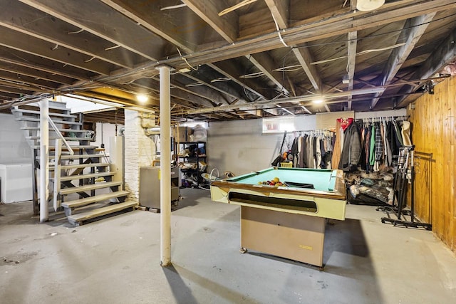 basement featuring stairway, gas water heater, pool table, and washer / clothes dryer