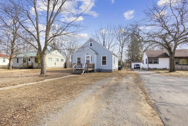 view of front of property with aphalt driveway and a residential view