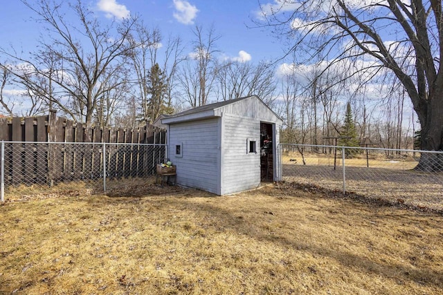 view of shed featuring a fenced backyard