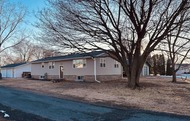 view of side of property featuring entry steps and an outdoor structure