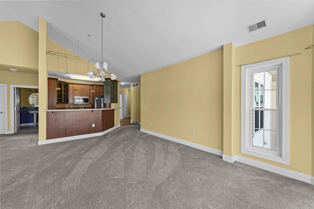 unfurnished living room with high vaulted ceiling, carpet, visible vents, and baseboards