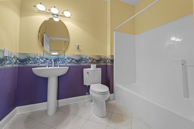 full bathroom featuring tile patterned floors, shower / washtub combination, and toilet