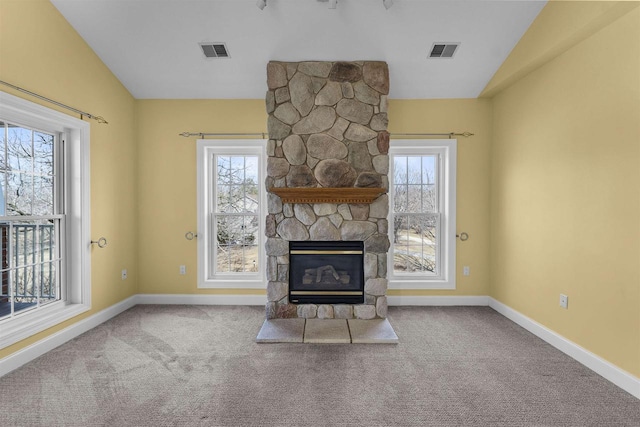 unfurnished living room featuring vaulted ceiling, visible vents, and carpet floors