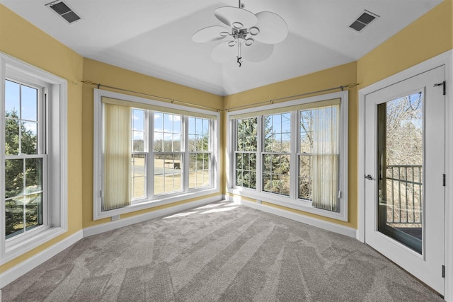 unfurnished sunroom with visible vents and ceiling fan