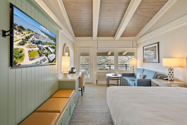 bedroom featuring lofted ceiling with beams, light colored carpet, and wooden ceiling