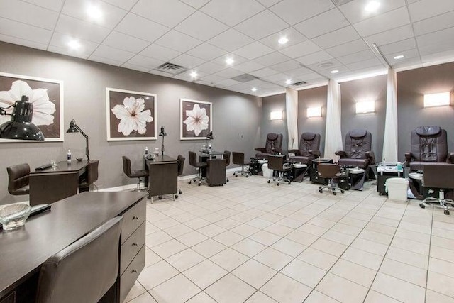 miscellaneous room featuring light tile patterned floors, visible vents, and a drop ceiling