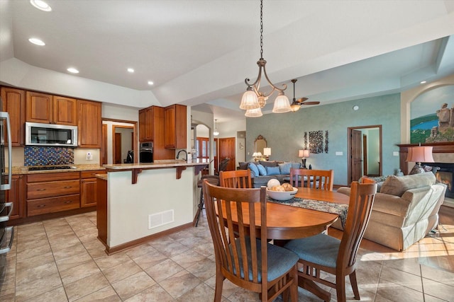 dining room featuring visible vents, recessed lighting, and a raised ceiling