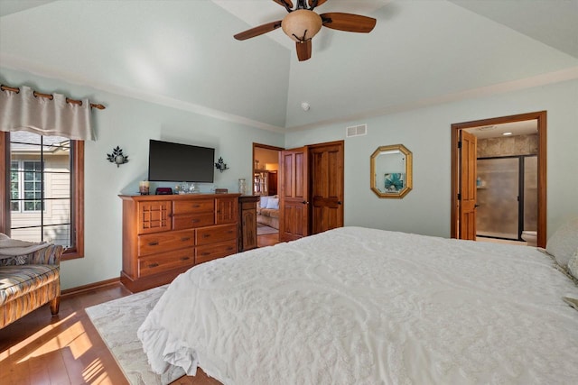 bedroom featuring visible vents, baseboards, vaulted ceiling, wood finished floors, and a ceiling fan