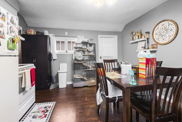 dining space with wood finished floors