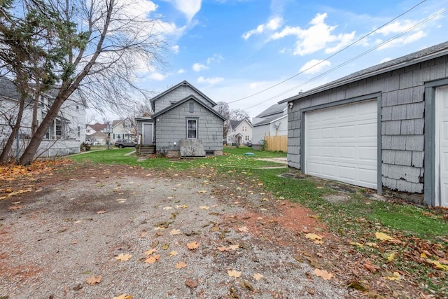 view of home's exterior with a garage and driveway