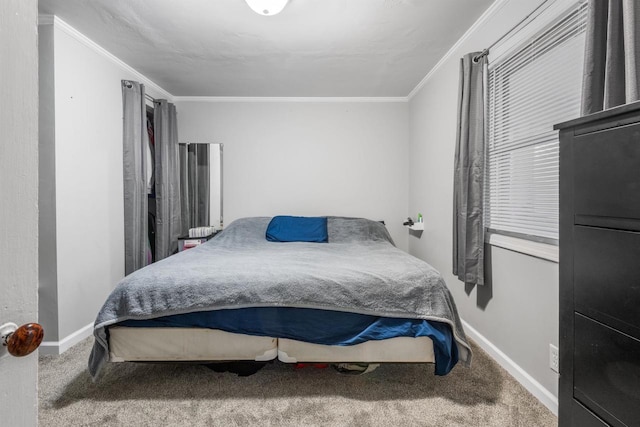 carpeted bedroom with baseboards and ornamental molding