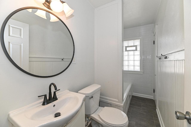 bathroom with tile patterned floors, toilet, and vanity