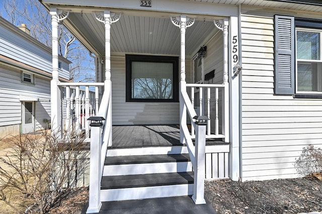 property entrance featuring covered porch