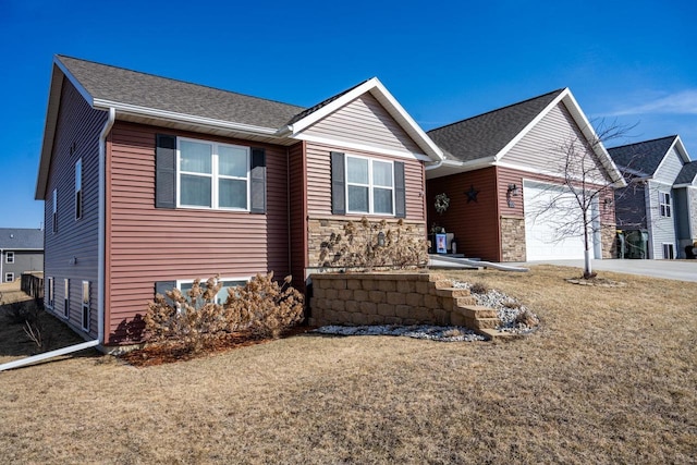 ranch-style home with stone siding, driveway, and an attached garage