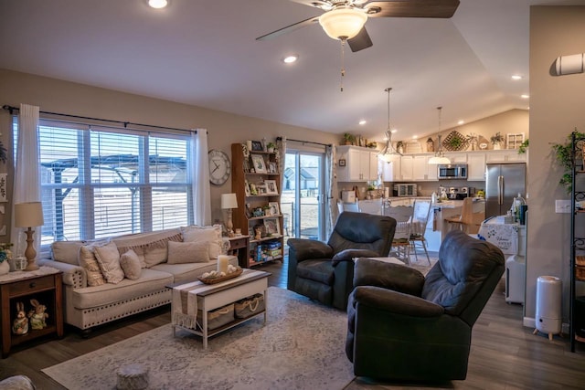 living room with recessed lighting, a ceiling fan, lofted ceiling, and dark wood-style flooring