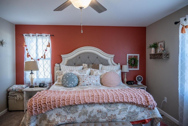 bedroom featuring baseboards, ceiling fan, and carpet flooring