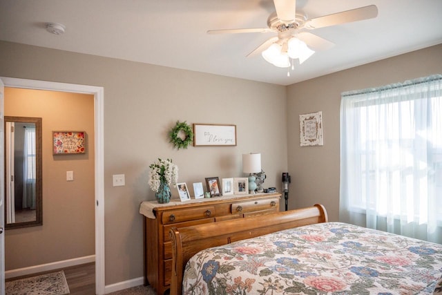 bedroom with baseboards and ceiling fan