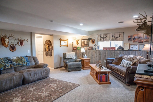 carpeted living area with recessed lighting and visible vents