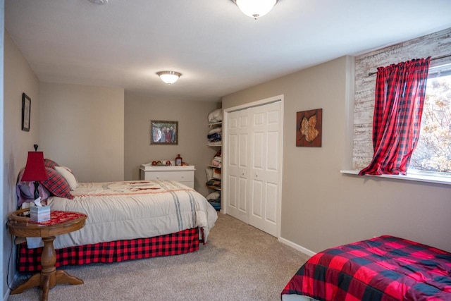 bedroom featuring baseboards and carpet floors