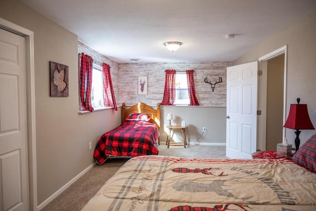 bedroom with baseboards, multiple windows, and carpet