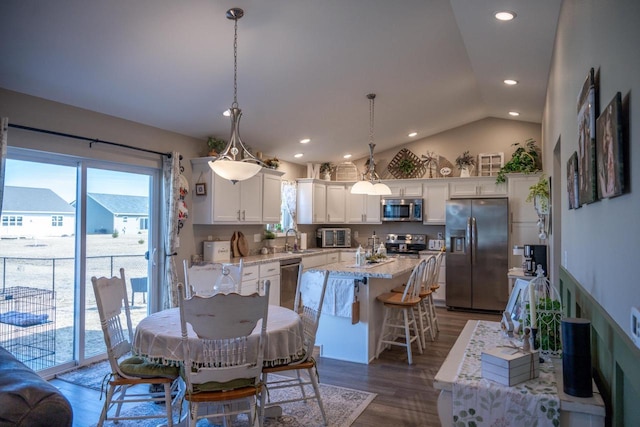 dining area featuring recessed lighting, lofted ceiling, and dark wood-style floors