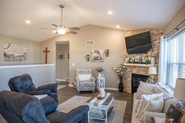 living room featuring visible vents, a ceiling fan, wood finished floors, a fireplace, and lofted ceiling