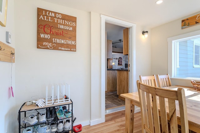 dining room featuring recessed lighting, baseboards, and light wood finished floors